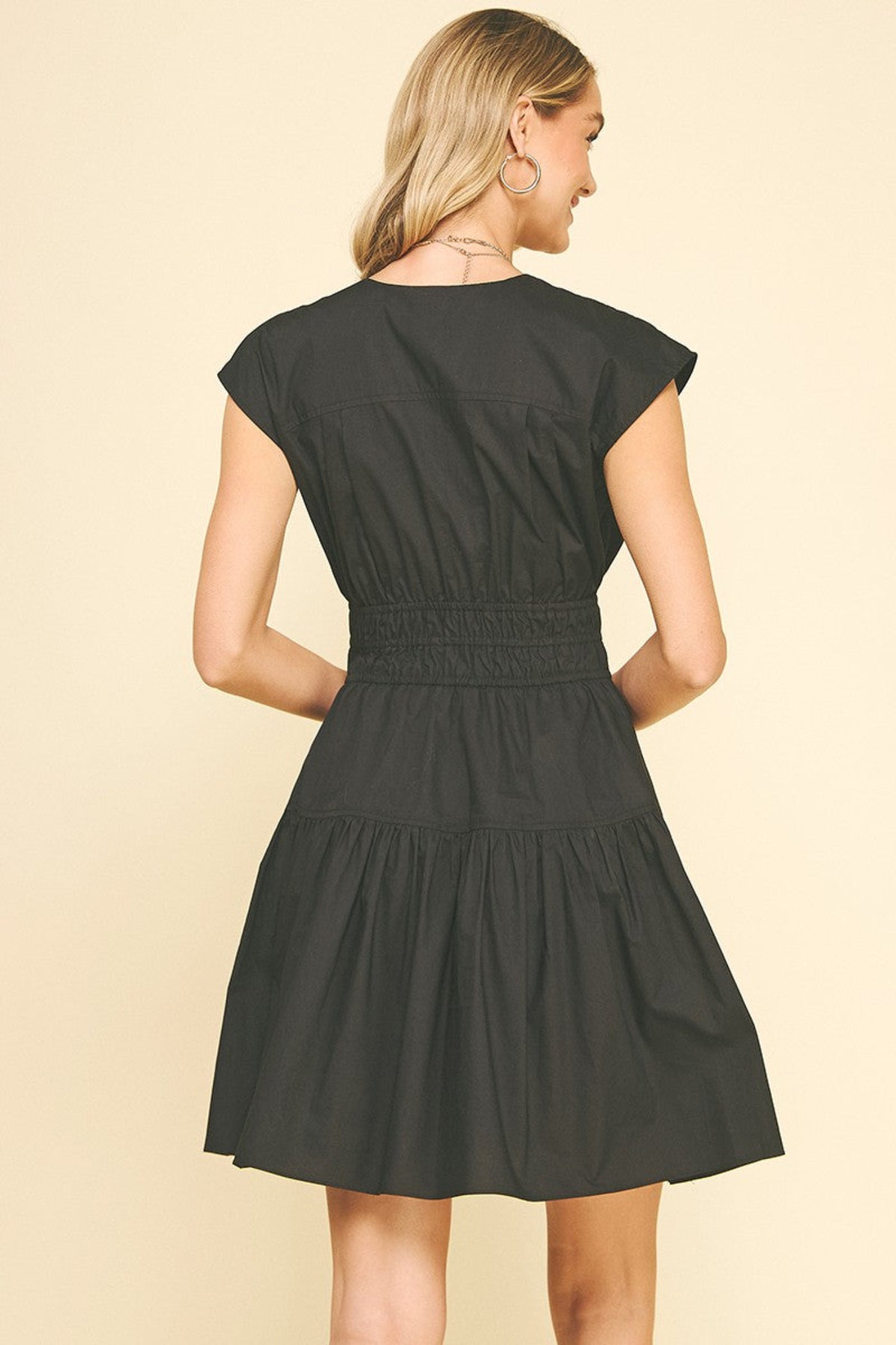 PINCH TIE DETAILED MINI DRESS – A FLIRTY V-NECK MINI WITH SMOCKING, TIERS, AND POCKETS