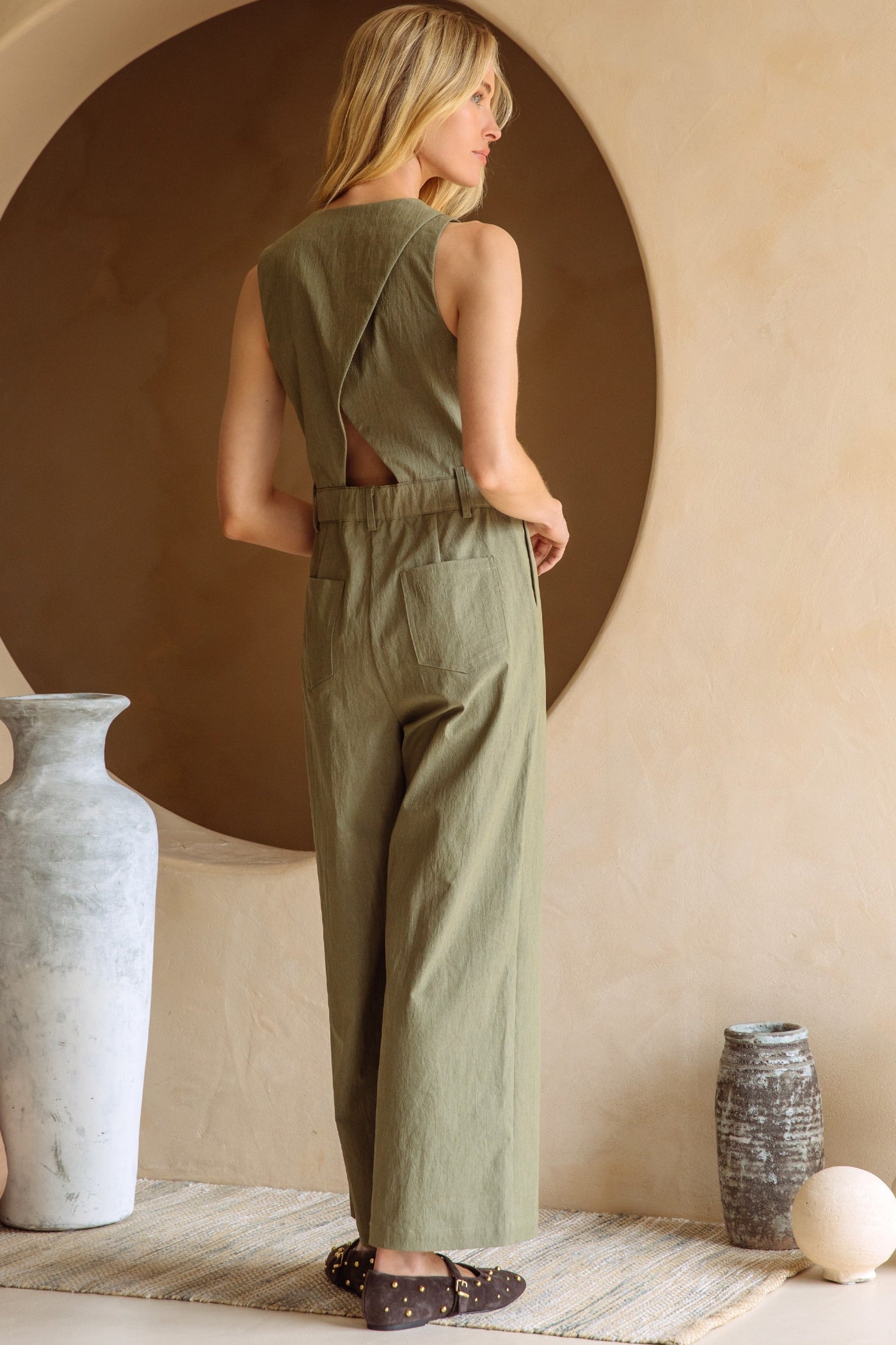 SKIES ARE BLUE BUTTON DOWN JUMPSUIT WITH CUTOUT BACK – AN OLIVE JUMPSUIT WITH A RELAXED FIT AND STYLISH BACK DETAIL
