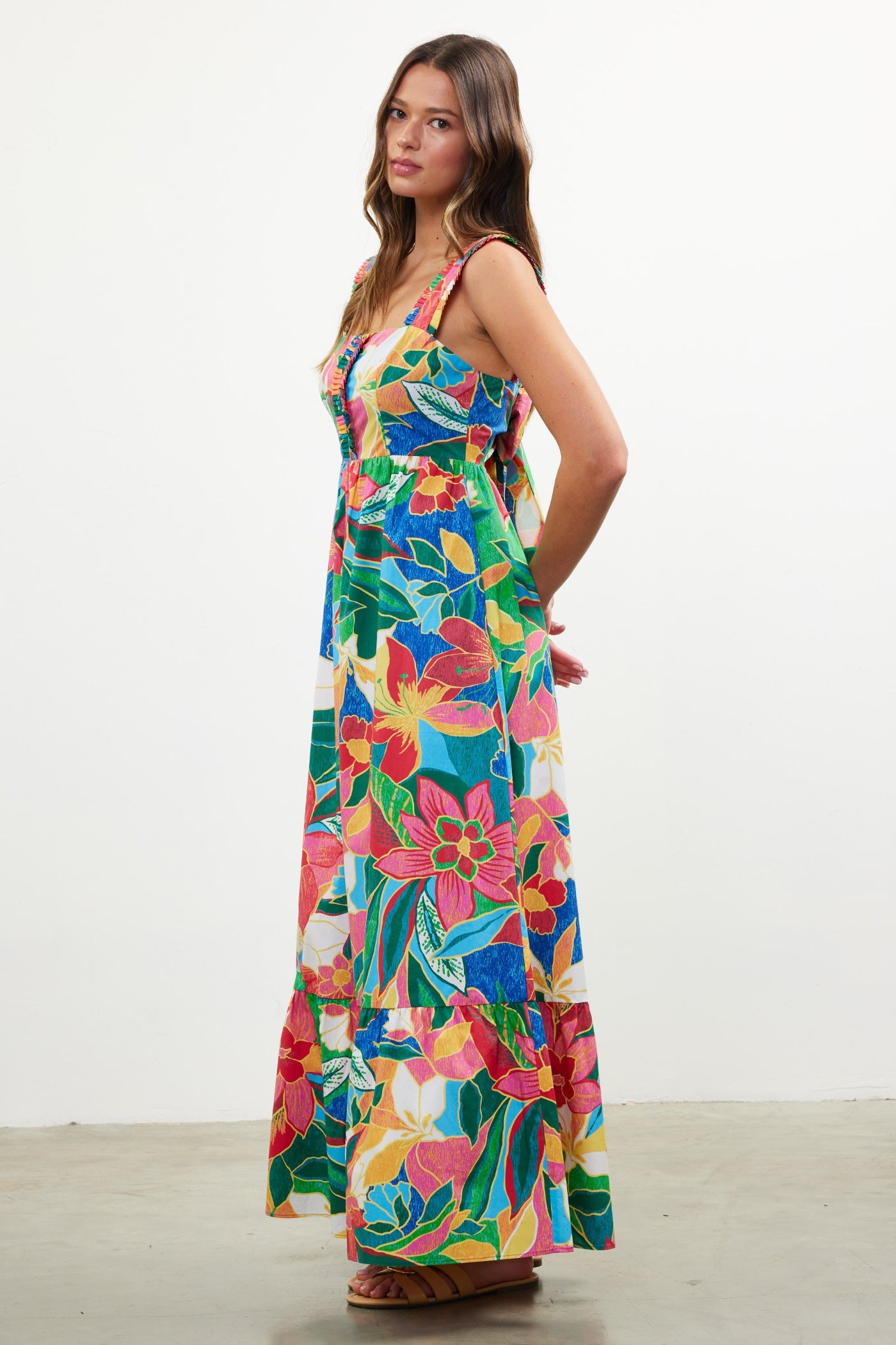 SKIES ARE BLUE THE PRINTED RUFFLE TIERED MAXI DRESS – A TROPICAL MULTICOLORED STATEMENT WITH TIE-BACK DETAIL AND FLOWING LAYERS
