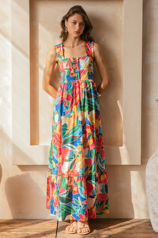 SKIES ARE BLUE THE PRINTED RUFFLE TIERED MAXI DRESS – A TROPICAL MULTICOLORED STATEMENT WITH TIE-BACK DETAIL AND FLOWING LAYERS DRESS WITH POCKETS