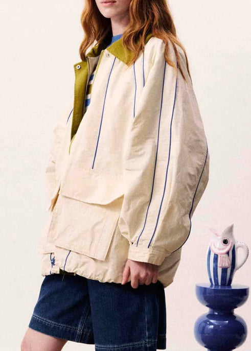 Oversized jacket with contrasting collar and visible stitching details
