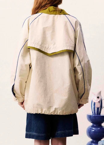 Oversized jacket with contrasting collar and visible stitching details
