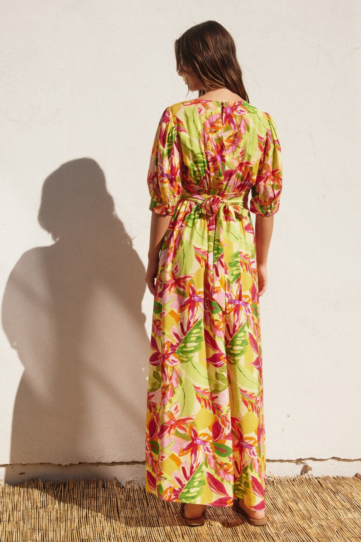 DRESS FORUM WHITE LOTUS SURPLICE SLIT MAXI DRESS – A TROPICAL FLORAL MAXI WITH A CINCHED WAIST AND AIRY SLIT SKIRT
