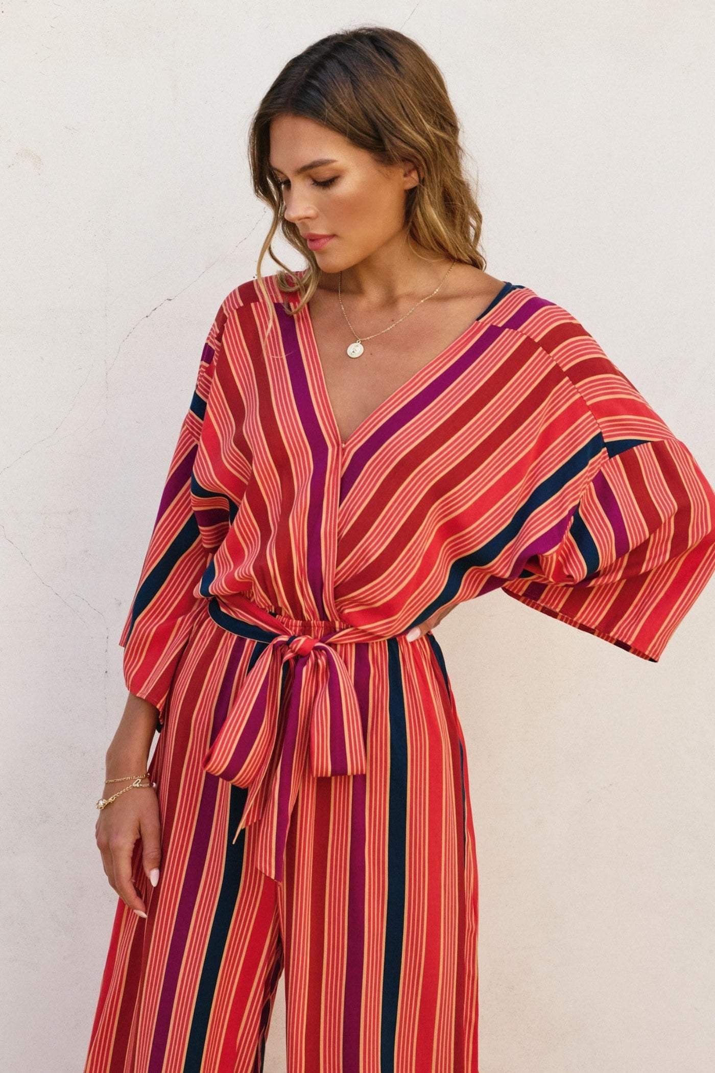 DRESS FORUM STRIPED KIMONO SURPLICE JUMPSUIT – A STRIPED ONE-AND-DONE LOOK WITH KIMONO SLEEVES AND A CINCHED WAIST