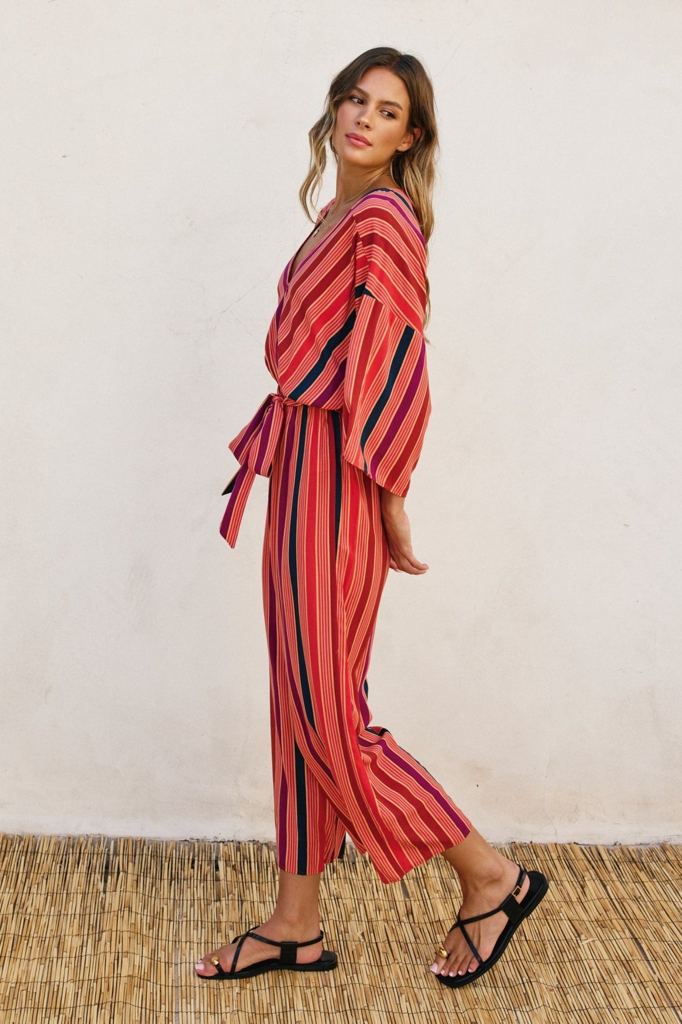 DRESS FORUM STRIPED KIMONO SURPLICE JUMPSUIT – A STRIPED ONE-AND-DONE LOOK WITH KIMONO SLEEVES AND A CINCHED WAIST