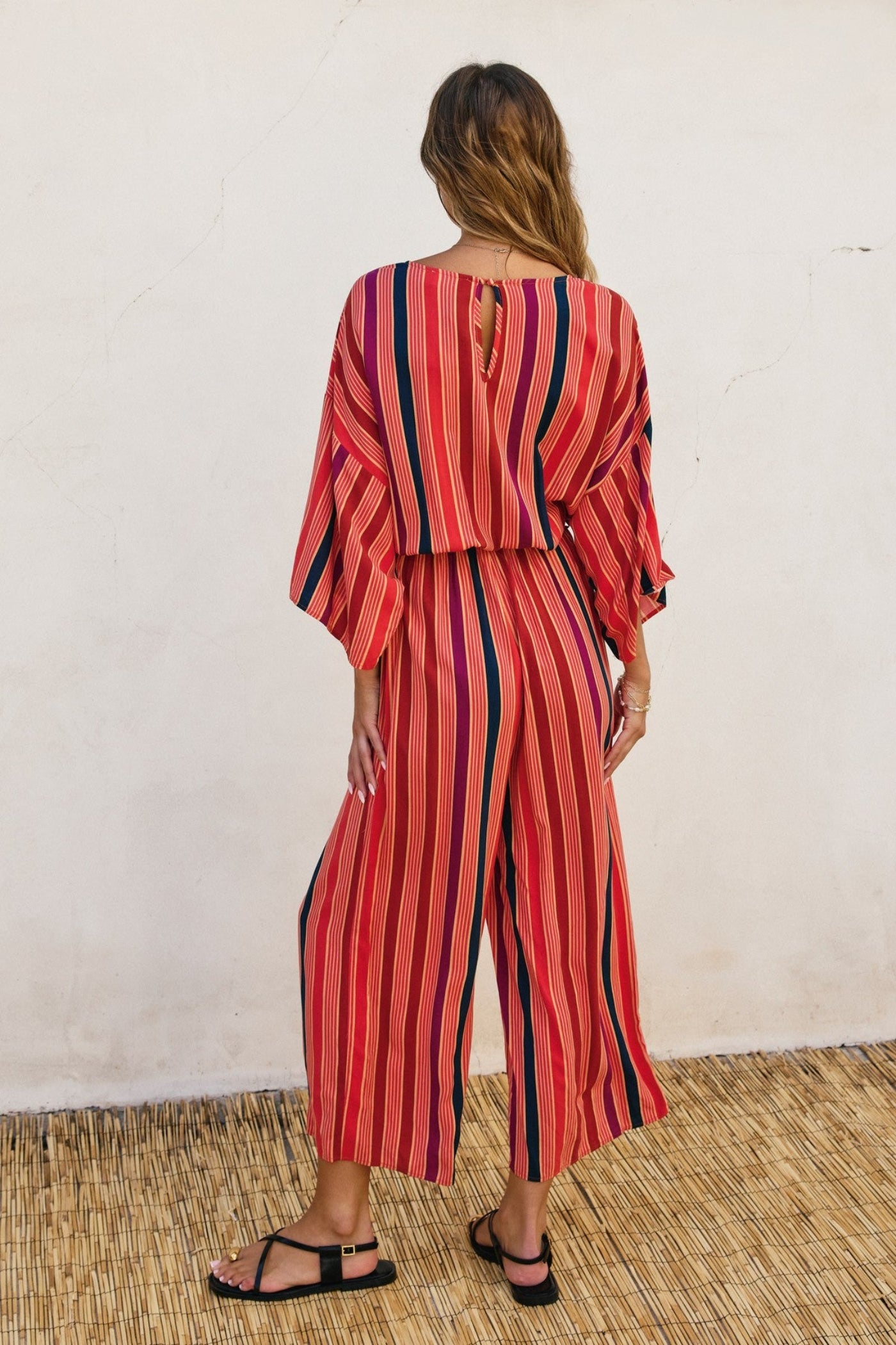 DRESS FORUM STRIPED KIMONO SURPLICE JUMPSUIT – A STRIPED ONE-AND-DONE LOOK WITH KIMONO SLEEVES AND A CINCHED WAIST