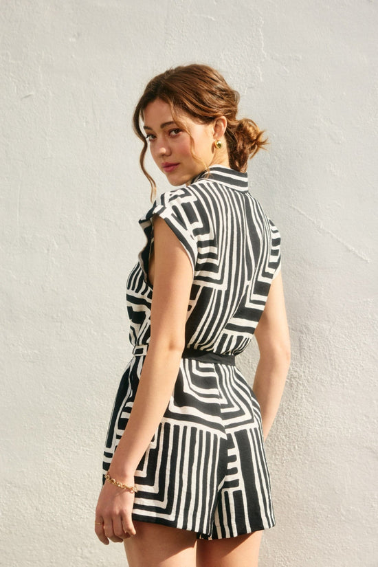 RUNAWAY BUTTON DOWN ROMPER – A PRINTED ONE-PIECE WITH TAILORED DETAILS AND A FLATTERING WAIST TIE