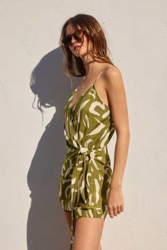 DRESS FORUM TROPICAL TWIST TIE-WAIST ROMPER – A WRAP-STYLE OLIVE ROMPER WITH A FLATTERING FIT AND ABSTRACT PRINT