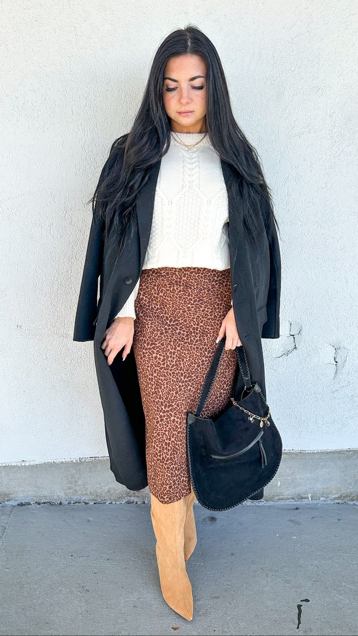 long black coat and leopard skirt