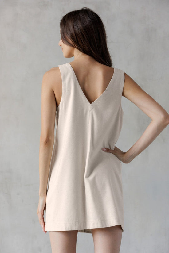 STORIA SAND V-NECK MINI DRESS – A SLEEVELESS, BUTTON-FRONT MINI WITH UTILITY CHARM