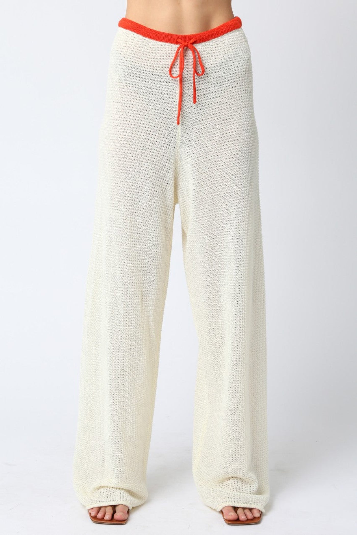 OLIVACEOUS MAO LINE KNIT PANTS – ADJUSTABLE STRAP STRAIGHT-FIT PANTS WITH VIBRANT ORANGE DETAIL
