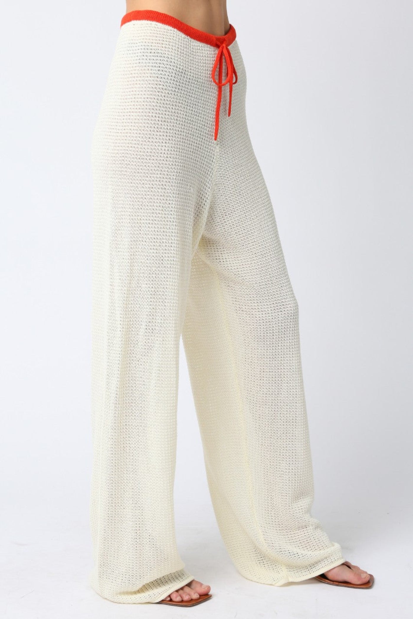 OLIVACEOUS MAO LINE KNIT PANTS – ADJUSTABLE STRAP STRAIGHT-FIT PANTS WITH VIBRANT ORANGE DETAIL