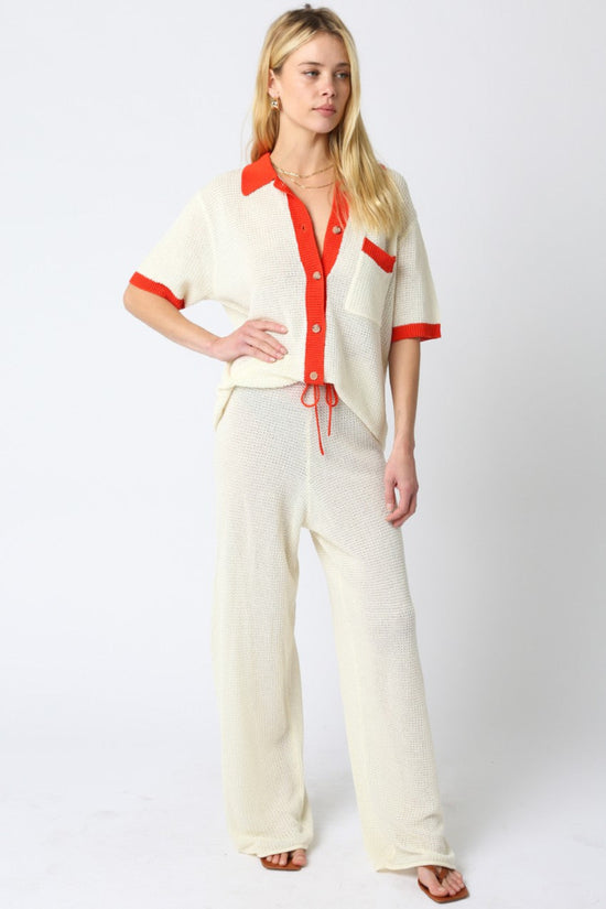 OLIVACEOUS MAO LINE KNIT PANTS – ADJUSTABLE STRAP STRAIGHT-FIT PANTS WITH VIBRANT ORANGE DETAIL