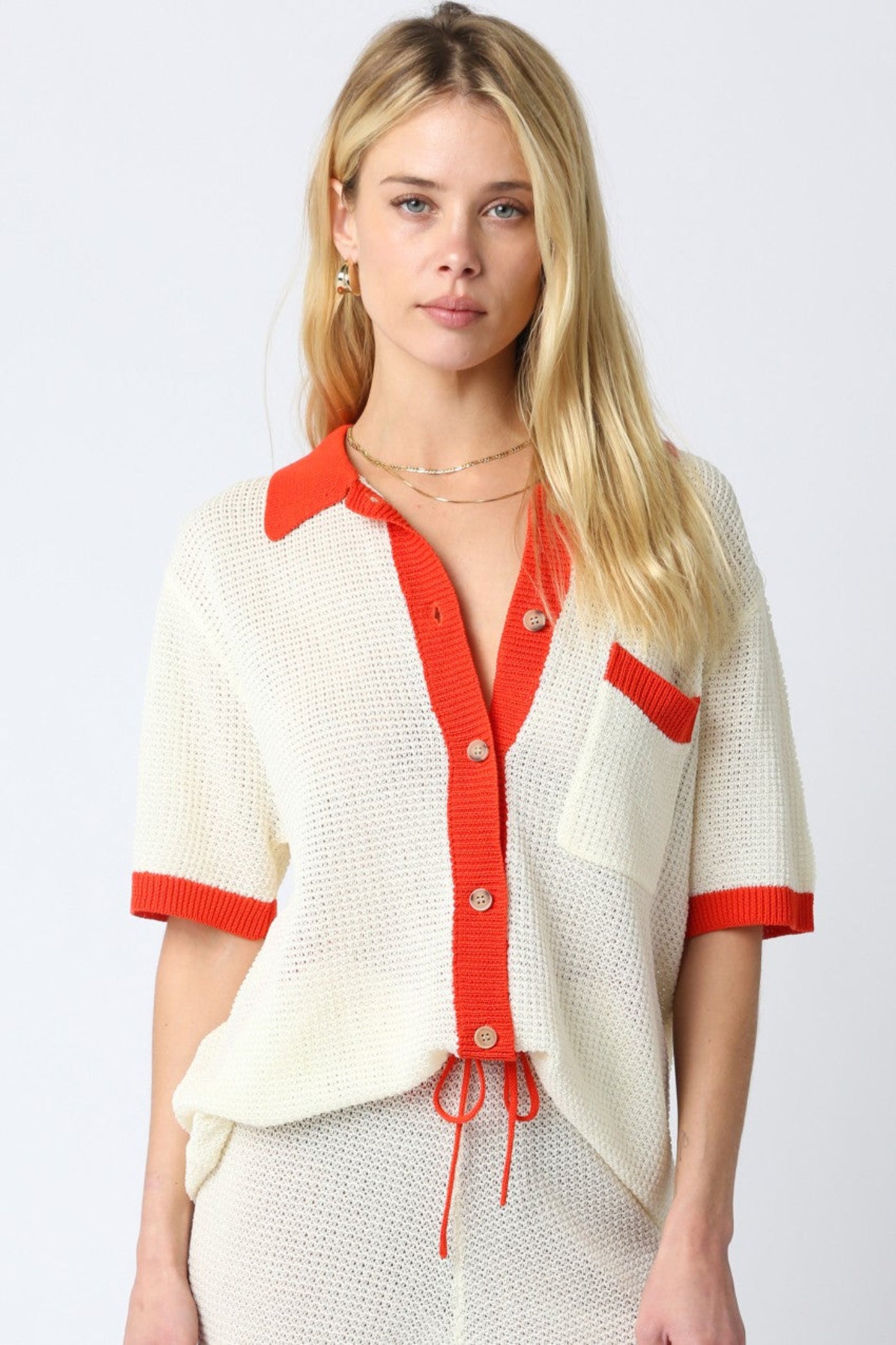OLIVACEOUS MAO LINE KNIT SWEATER – SHEER BUTTON-DOWN KNIT WITH VIBRANT ORANGE TRIM DETAILS