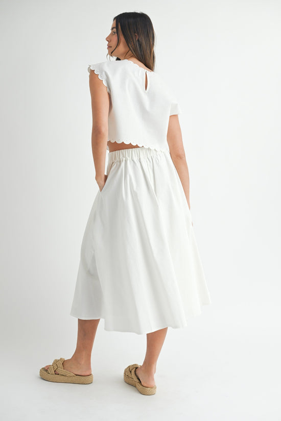 MABLE EMBROIDERY SCALLOP CROP TOP – A RELAXED LINEN-BLEND CROP WITH TONE-ON-TONE EMBROIDERY AND SCALLOPED EDGES