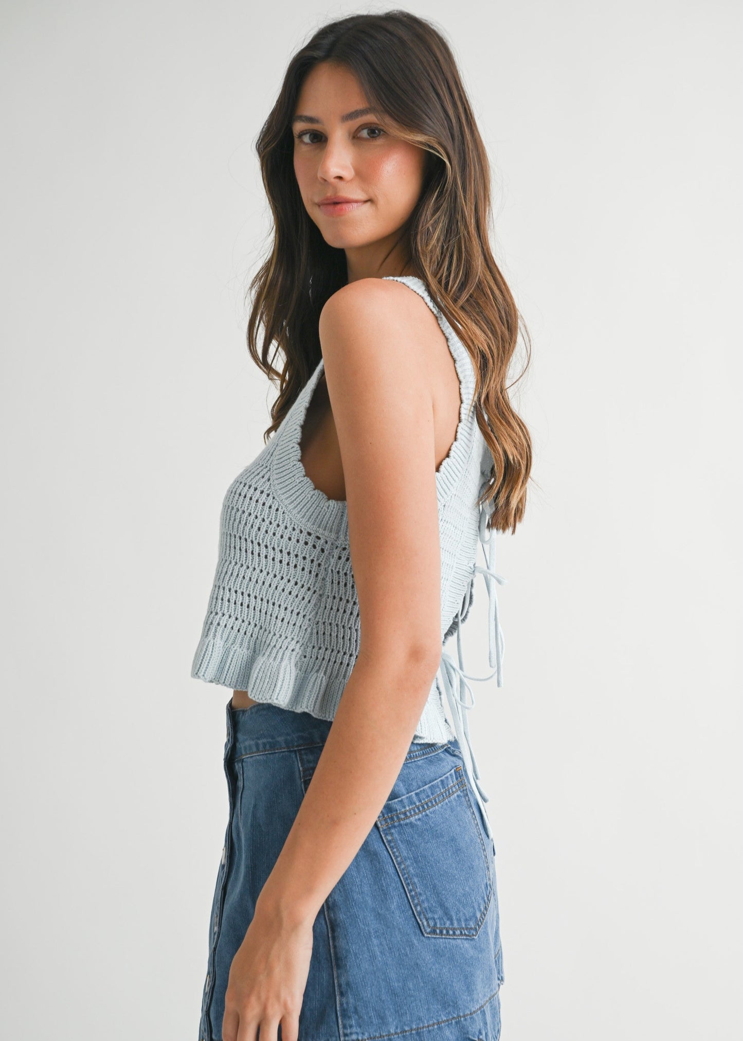 MABLE THE REVERSIBLE CROCHET RUFFLE HEM KNIT TOP – A CROPPED, TIE-FRONT KNIT WITH A PLAYFUL RUFFLED FINISH