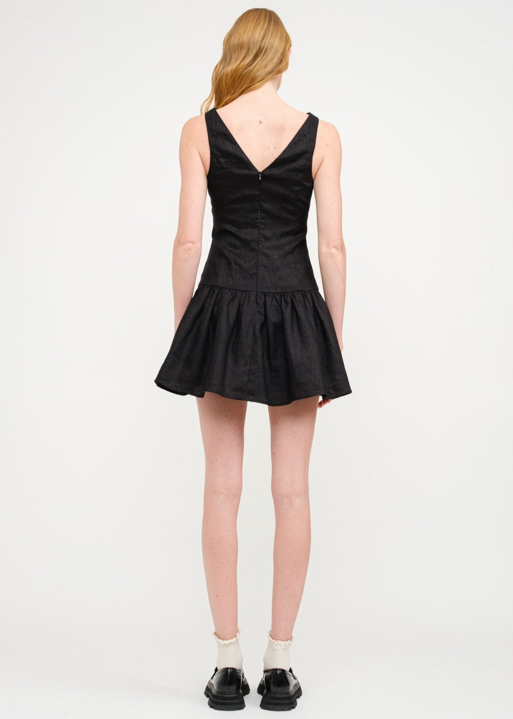 SOFIE THE LABEL THE MADELYN MINI DRESS – A SLEEVELESS LINEN DROP-WAIST MINI WITH A BOAT NECK AND ELEGANT BACK DETAIL BLACK COLOR