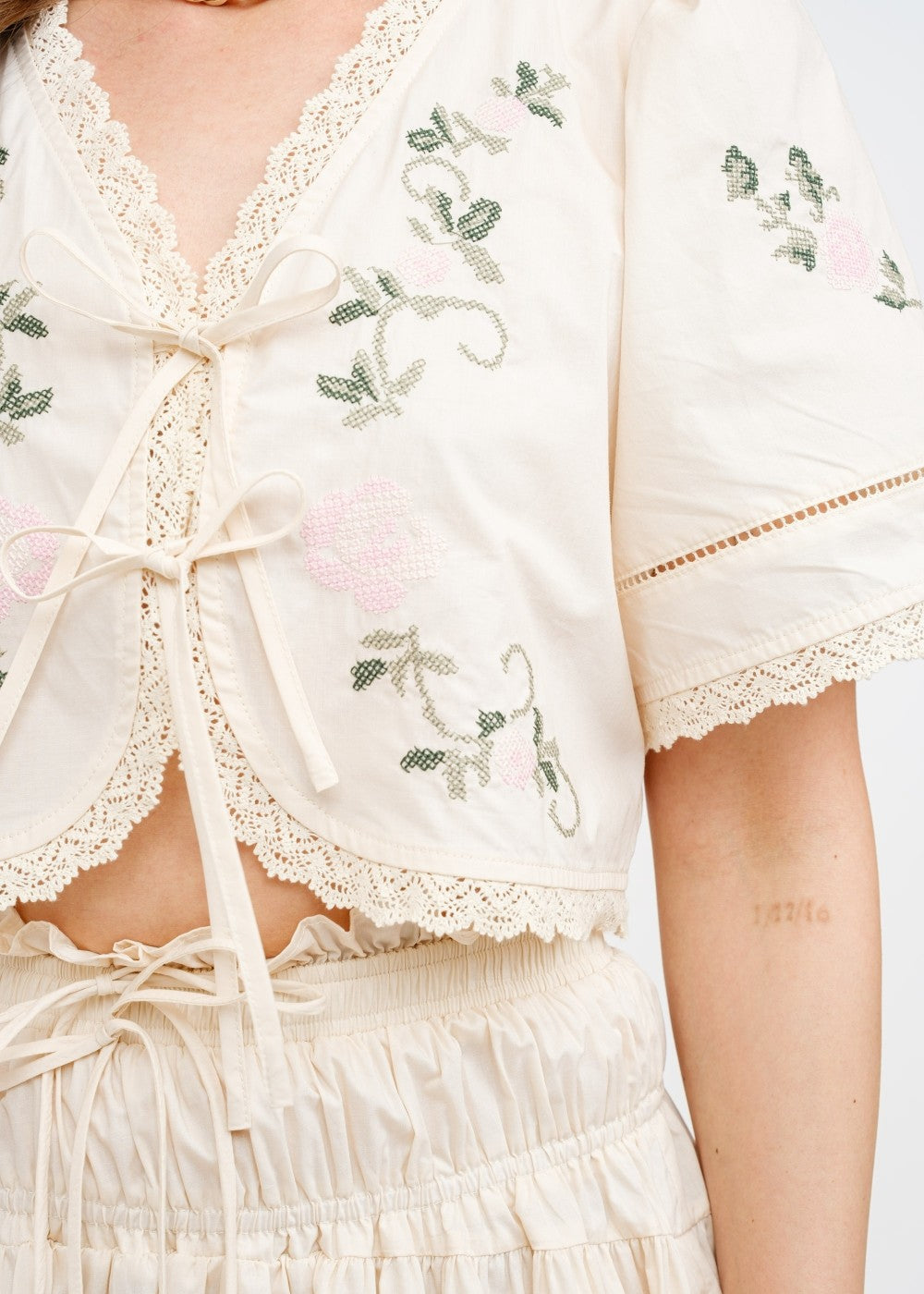 SOFIE THE LABEL THE SIVAN CREAM BLOUSE – A COTTON-POPLIN CROPPED BLOUSE WITH DELICATE FLORAL EMBROIDERY