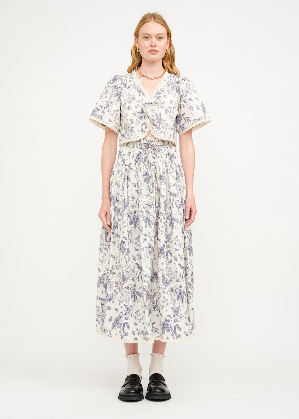 SOFIE THE LABEL THE AMELIE FLORAL BLOUSE – A COTTON-POPLIN PRINTED TOP WITH A CREAM AND NAVY FLORAL PALETTE