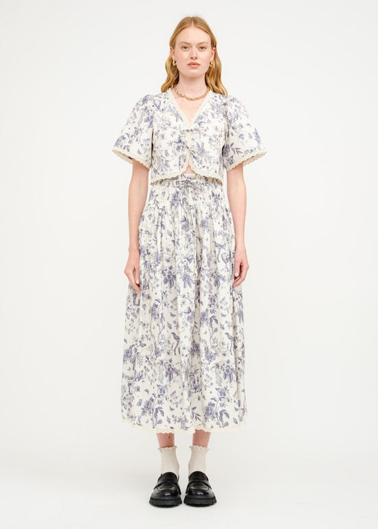 SOFIE THE LABEL THE AMELIE FLORAL BLOUSE – A COTTON-POPLIN PRINTED TOP WITH A CREAM AND NAVY FLORAL PALETTE