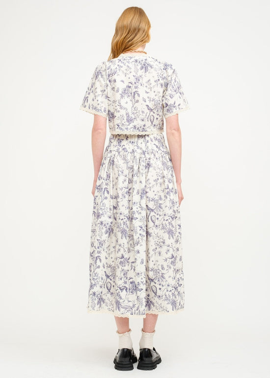 SOFIE THE LABEL THE AMELIE FLORAL BLOUSE – A COTTON-POPLIN PRINTED TOP WITH A CREAM AND NAVY FLORAL PALETTE