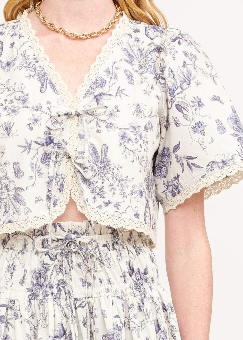 SOFIE THE LABEL THE AMELIE FLORAL BLOUSE – A COTTON-POPLIN PRINTED TOP WITH A CREAM AND NAVY FLORAL PALETTE