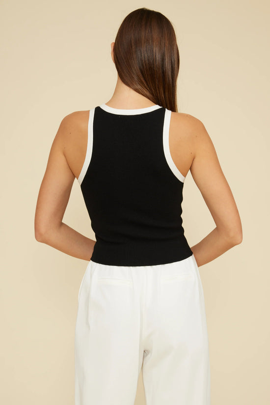 LUCY PARIS BRANDI CUTAWAY TANK TOP – A SLEEK BLACK TANK WITH WHITE TRIM AND A MODERN SILHOUETTE