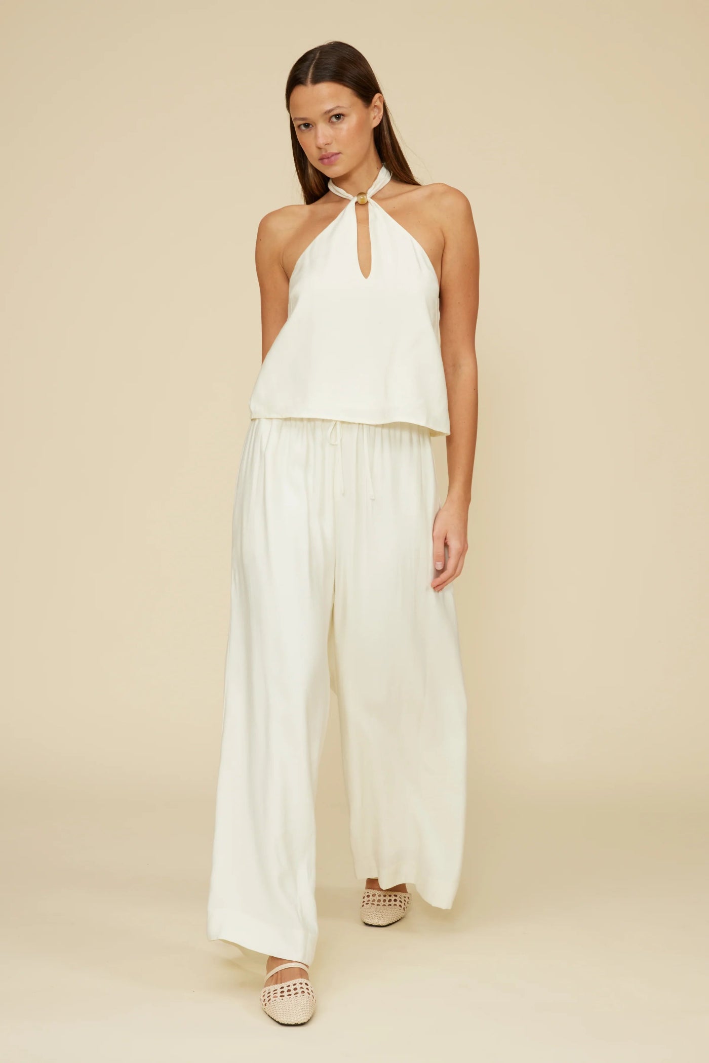 LUCY PARIS WILLA HALTER TOP – AN IVORY HALTER BLOUSE WITH BEADED DETAILING AND AN OPEN BACK